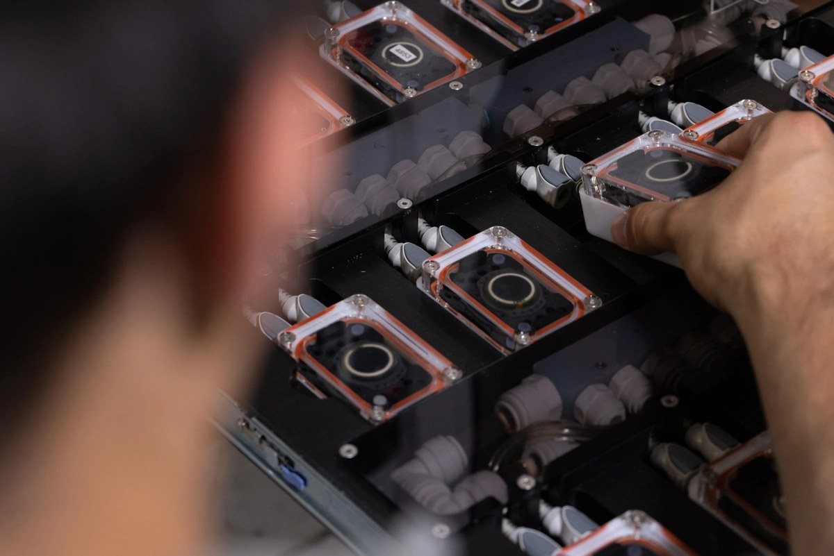 Neuralink hardware modules on a lab tray